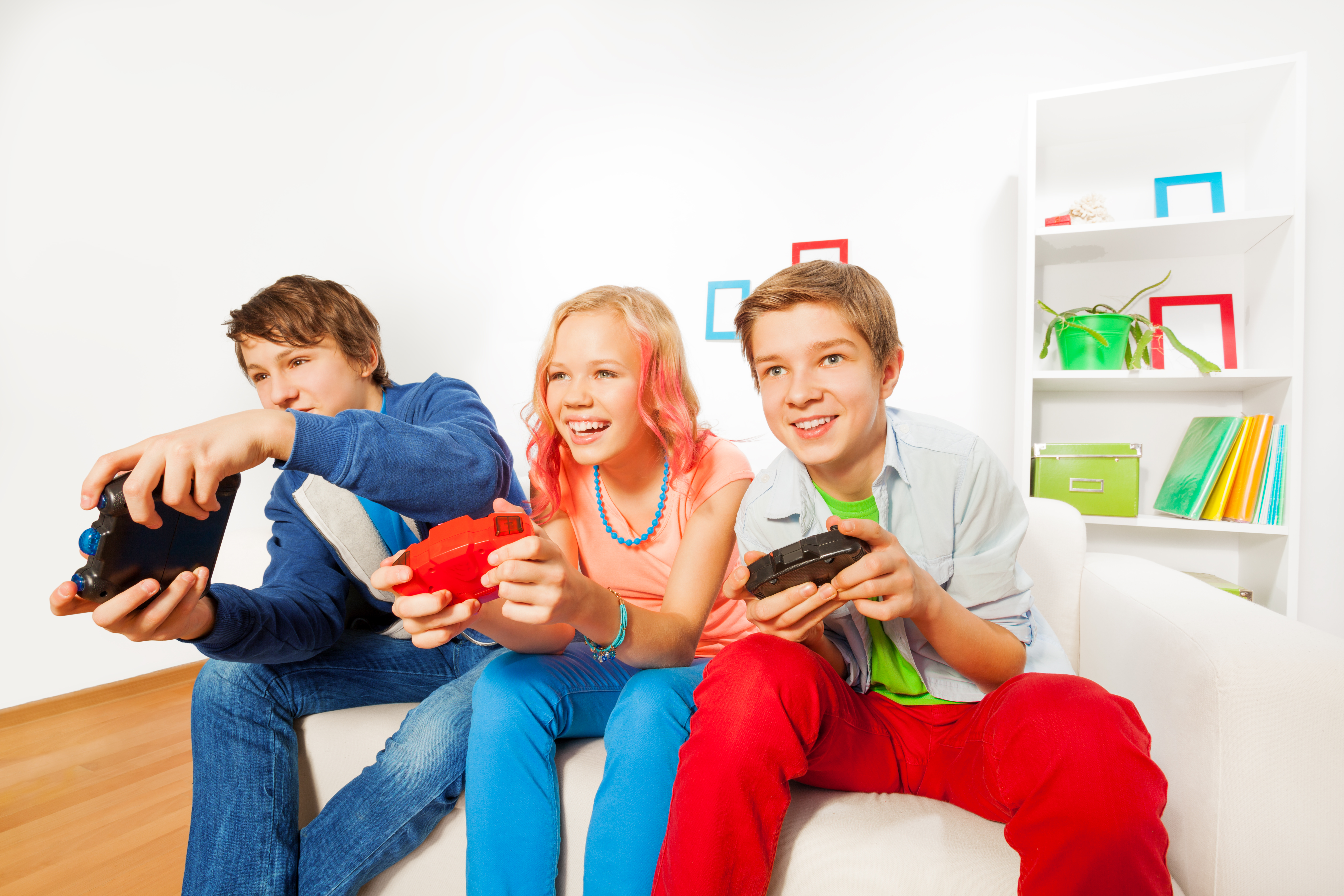 Three kids playing a video game