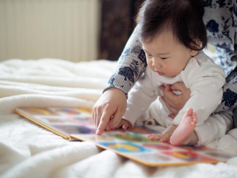 Baby looking at a book