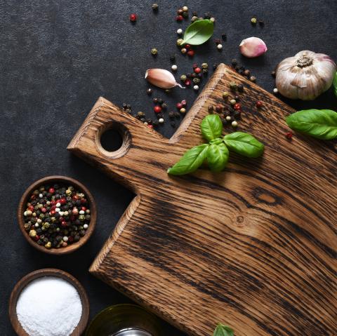 cutting board with herbs and spices