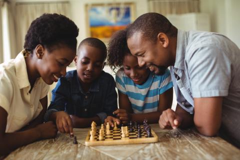 family playing chess