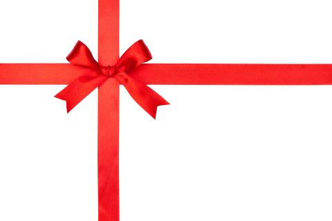 white gift wrapped with a red bow