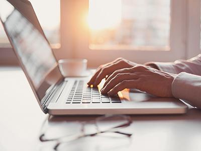 Person typing on a laptop