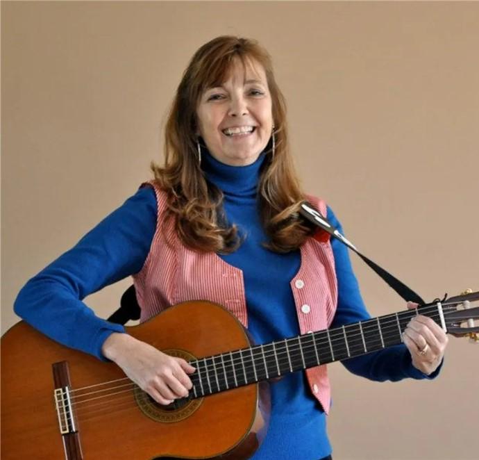 Woman holding a guitar