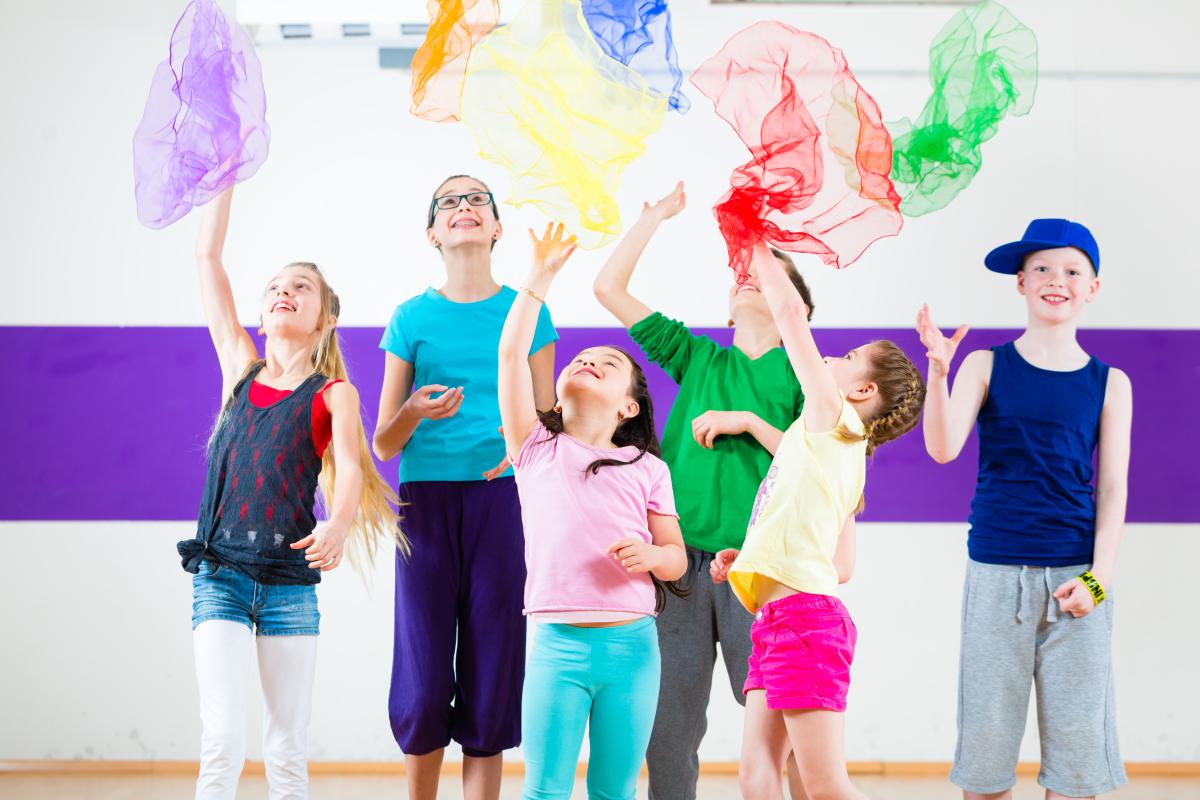 Children throwing scarves in the air