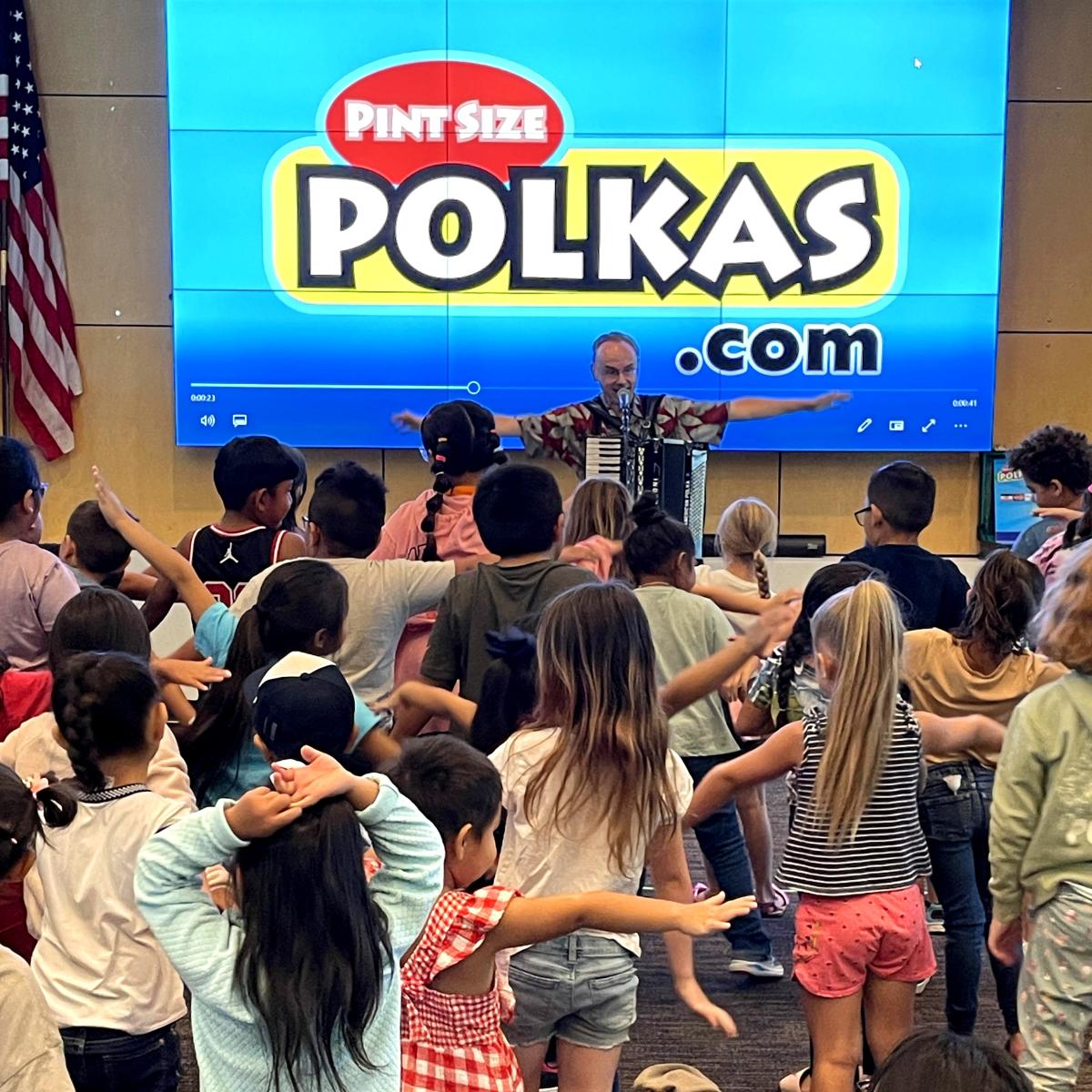 Pint Size Polkas performing for a crowd